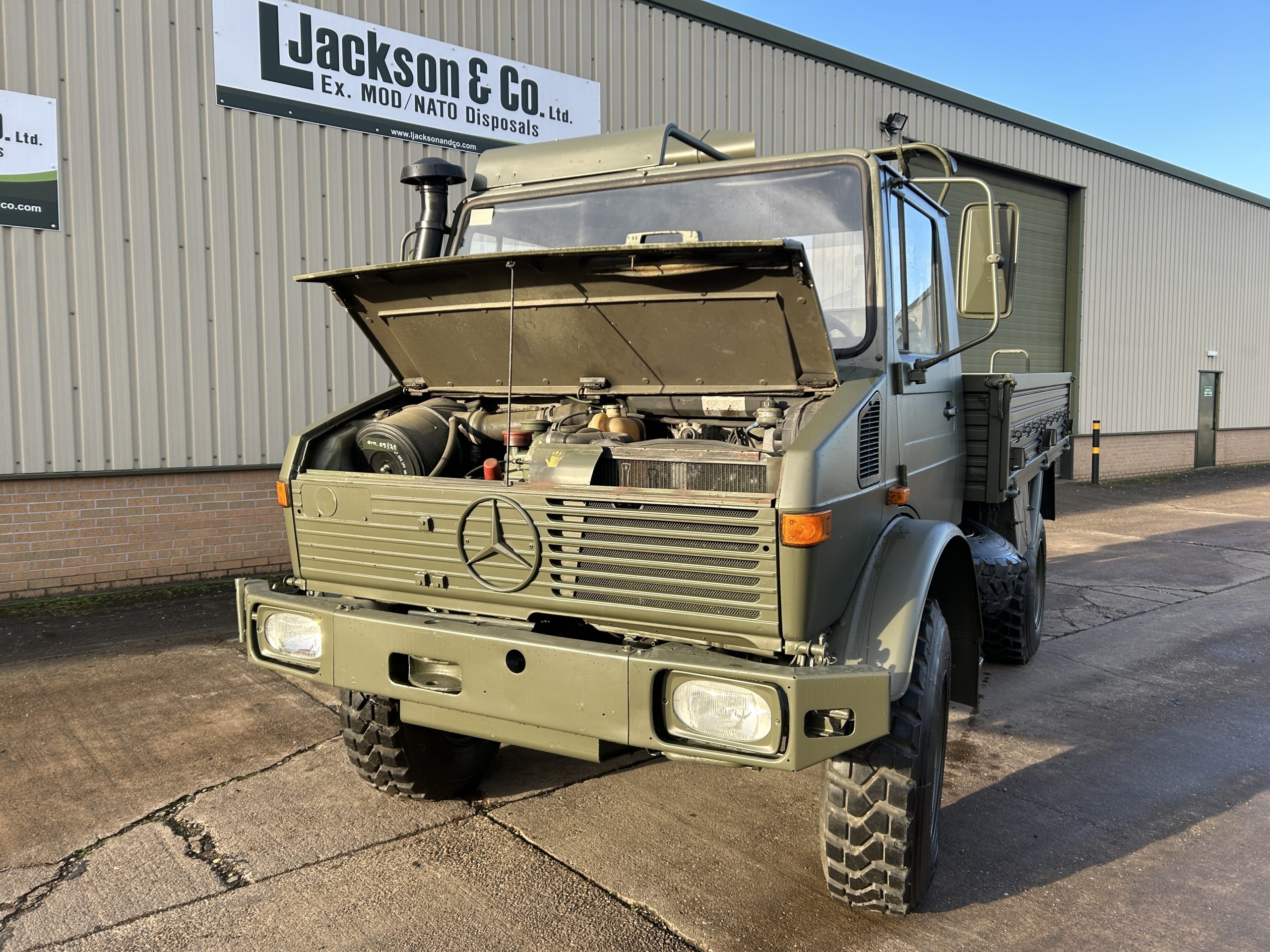 Mercedes Unimog U1300L 4×4 Drop Side Cargo Truck