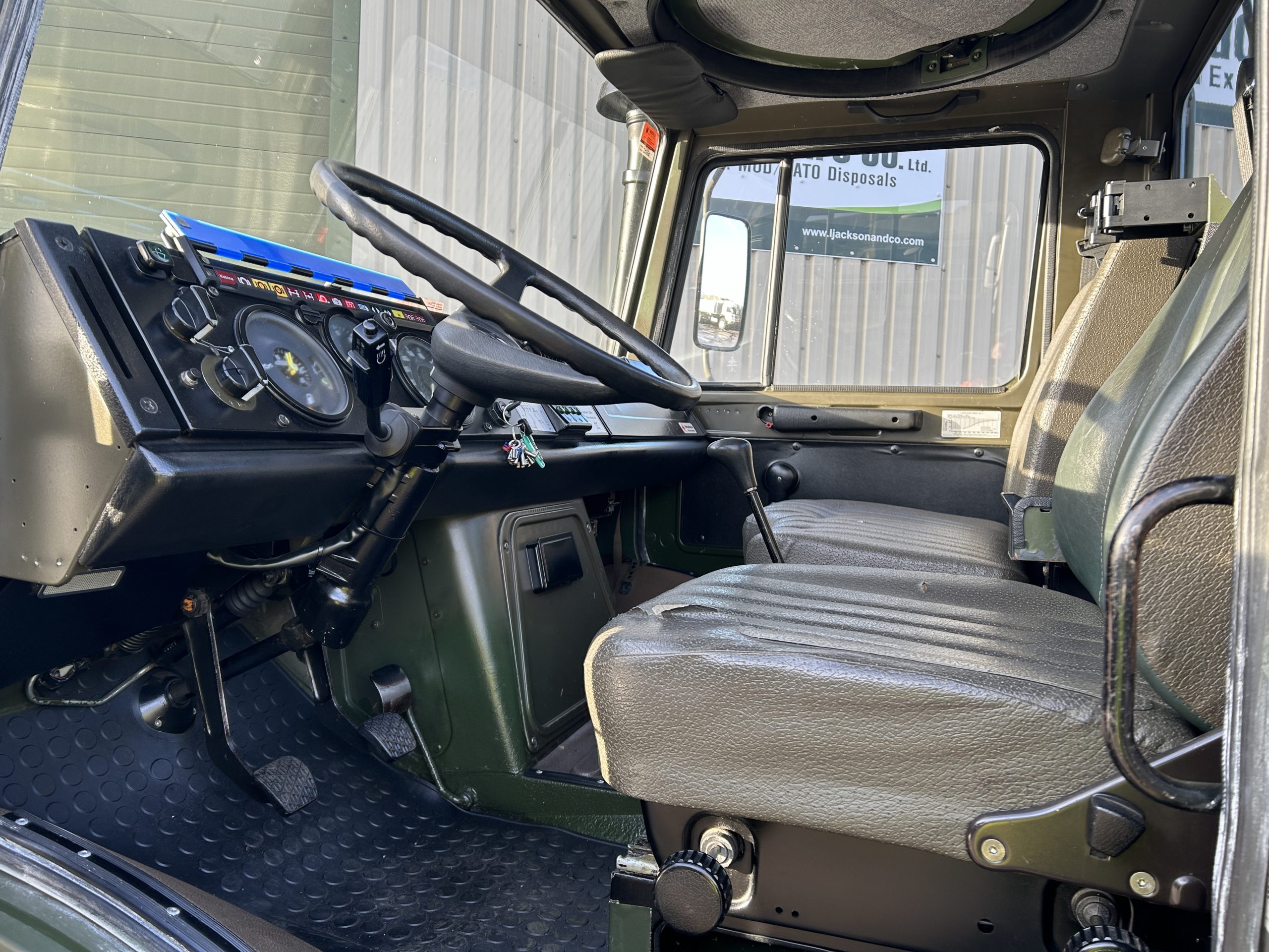 Mercedes Unimog U1300L 4×4 Drop Side Cargo Truck